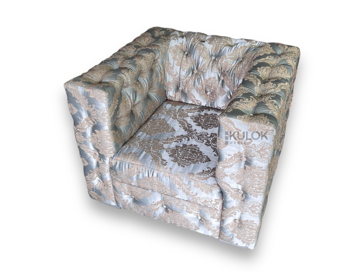 Fotel złoty z pikowanymi detalami