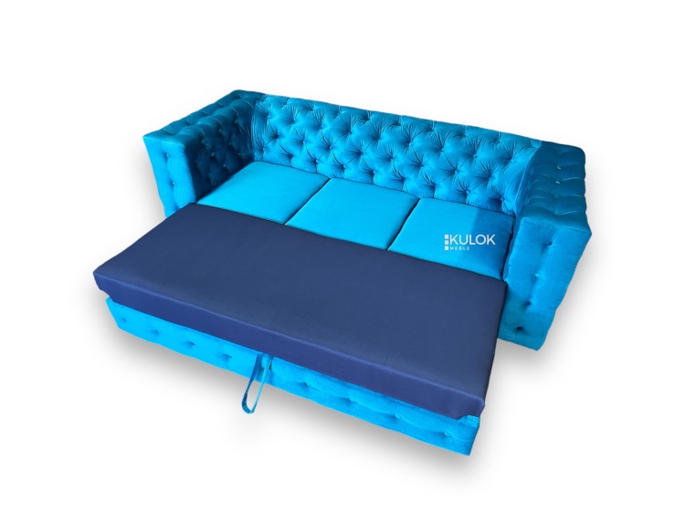 Pikowana kanapa z funkcja spania w niebieskim welurze