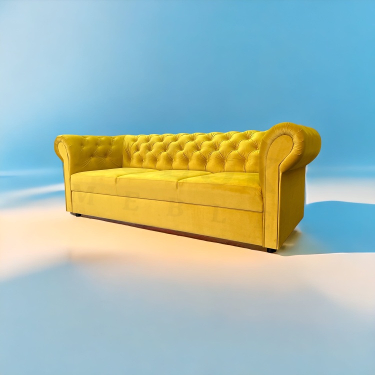 Trzyosobowa sofa pikowana z funkcja spania w żółtym welurze.