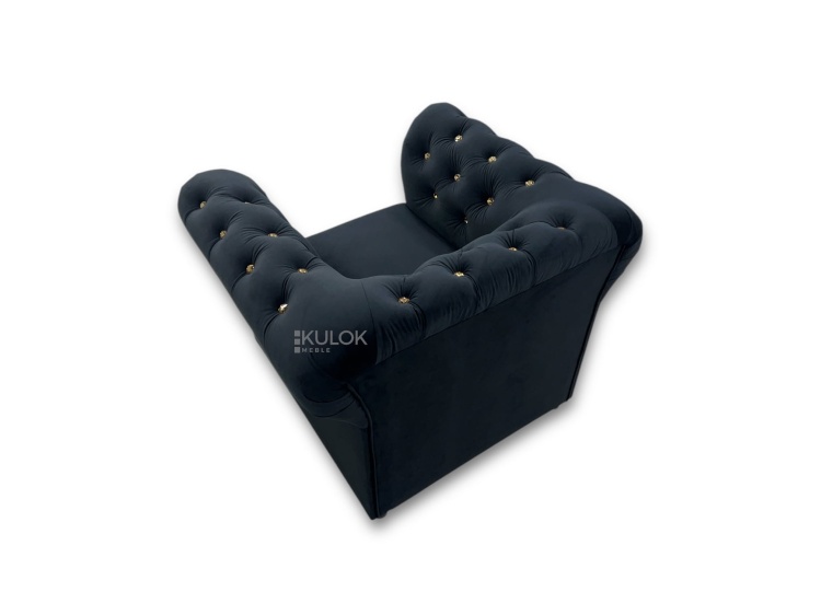 bok fotela chesterfield z ozdobnym pikowaniem i złotymi guzikami