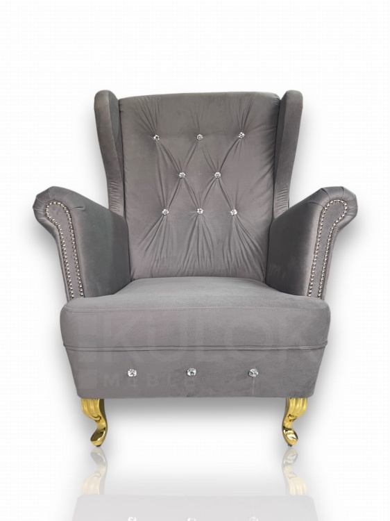 Fotel Uszak z złotymi akcentami - unikatowy design do nowoczesnego salonu.