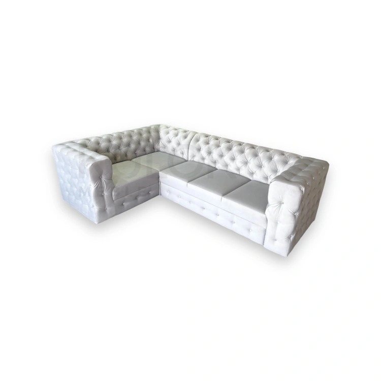 Luksusowa kanapa narożna w salonie aranżacja chesterfield pikowany manchester od producent mebli Kępno.