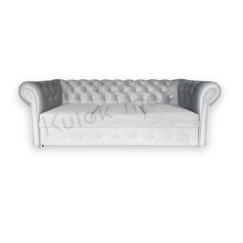Pikowana sofa w szarym kolorze z subtelnymi kryształkami