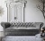 Srebrna sofa chesterfield z funkcją spania