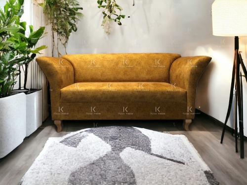 Nowoczesna sofa do salonu w stylu skandynawskim na wysokich nogach orzech w imitacji skóry. Salon nowoczesny loft.